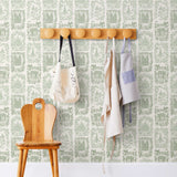 Je T'aime Paris (Sage) wallpaper featuring green illustrations of Paris landmarks on a white background | Nathalie Lete + Hygge & West