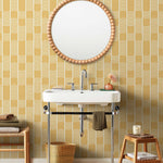 Wallpaper with undulating mustard yellow lines that form rhythmic columns on a white background | Schoolhouse + Hygge & West