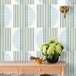 Wallpaper with irregular line work that weaves green rectangles and blue semicircles on a white background | Schoolhouse + Hygge & West