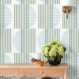 Wallpaper with irregular line work that weaves green rectangles and blue semicircles on a white background | Schoolhouse + Hygge & West