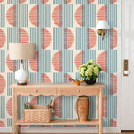 Wallpaper with irregular line work that weaves blue rectangles and red semicircles on an off white background | Schoolhouse + Hygge & West