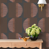 Wallpaper with irregular line work that weaves copper rectangles and pink semicircles on a deep gray background | Schoolhouse + Hygge & West