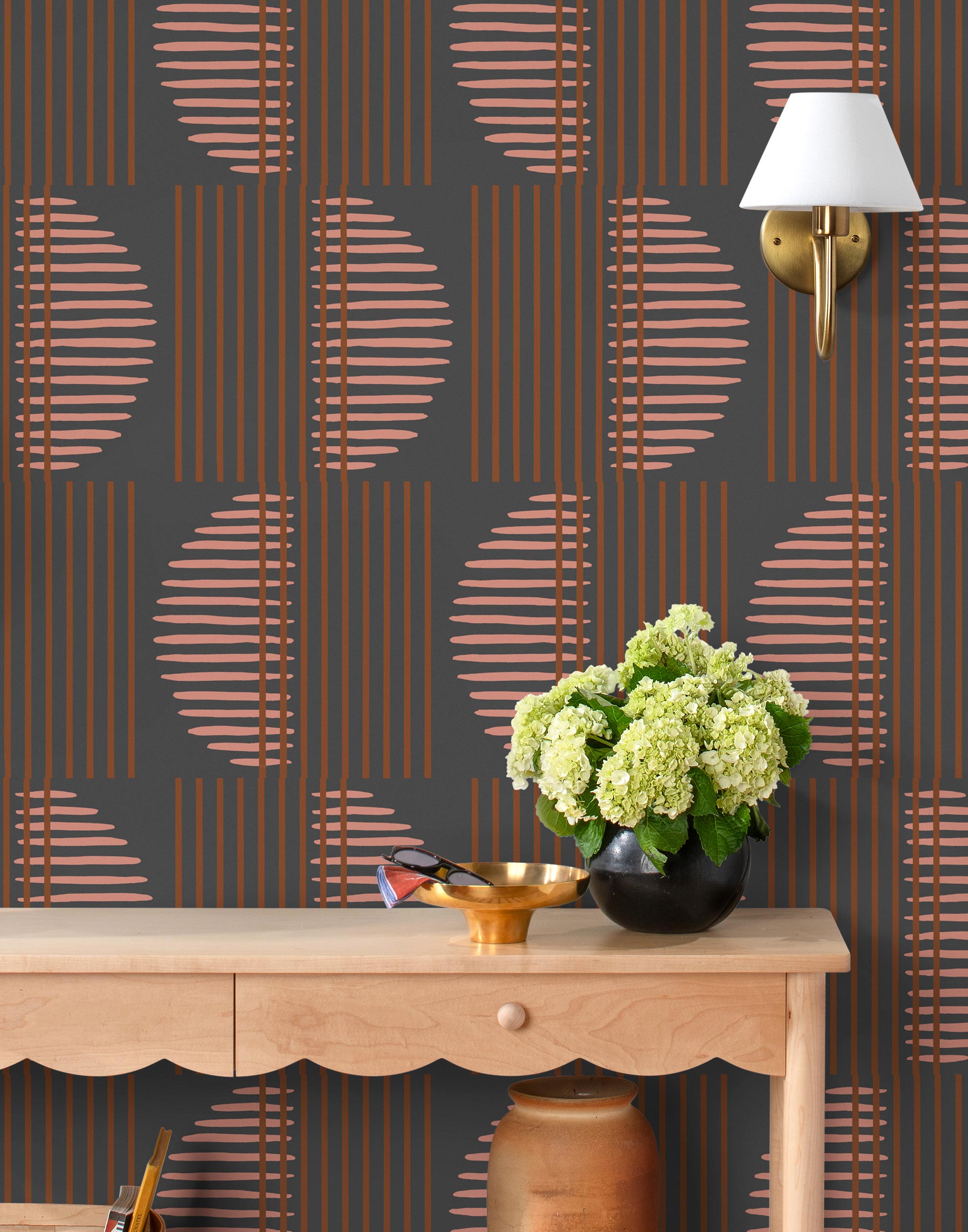 Wallpaper with irregular line work that weaves copper rectangles and pink semicircles on a deep gray background | Schoolhouse + Hygge & West