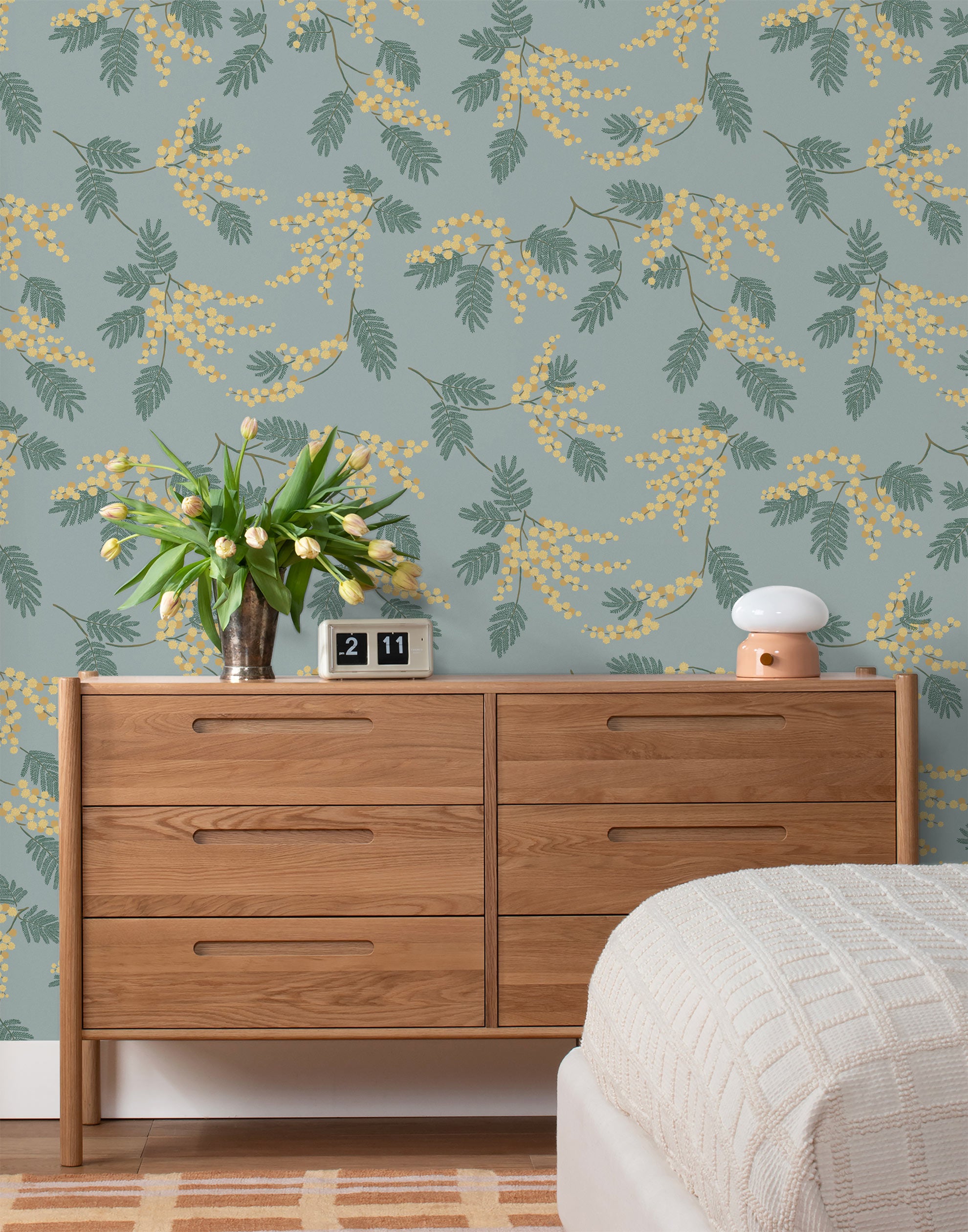 Wallpaper with yellow acacia flowers and green leaves on a dusty blue background | Schoolhouse + Hygge & West