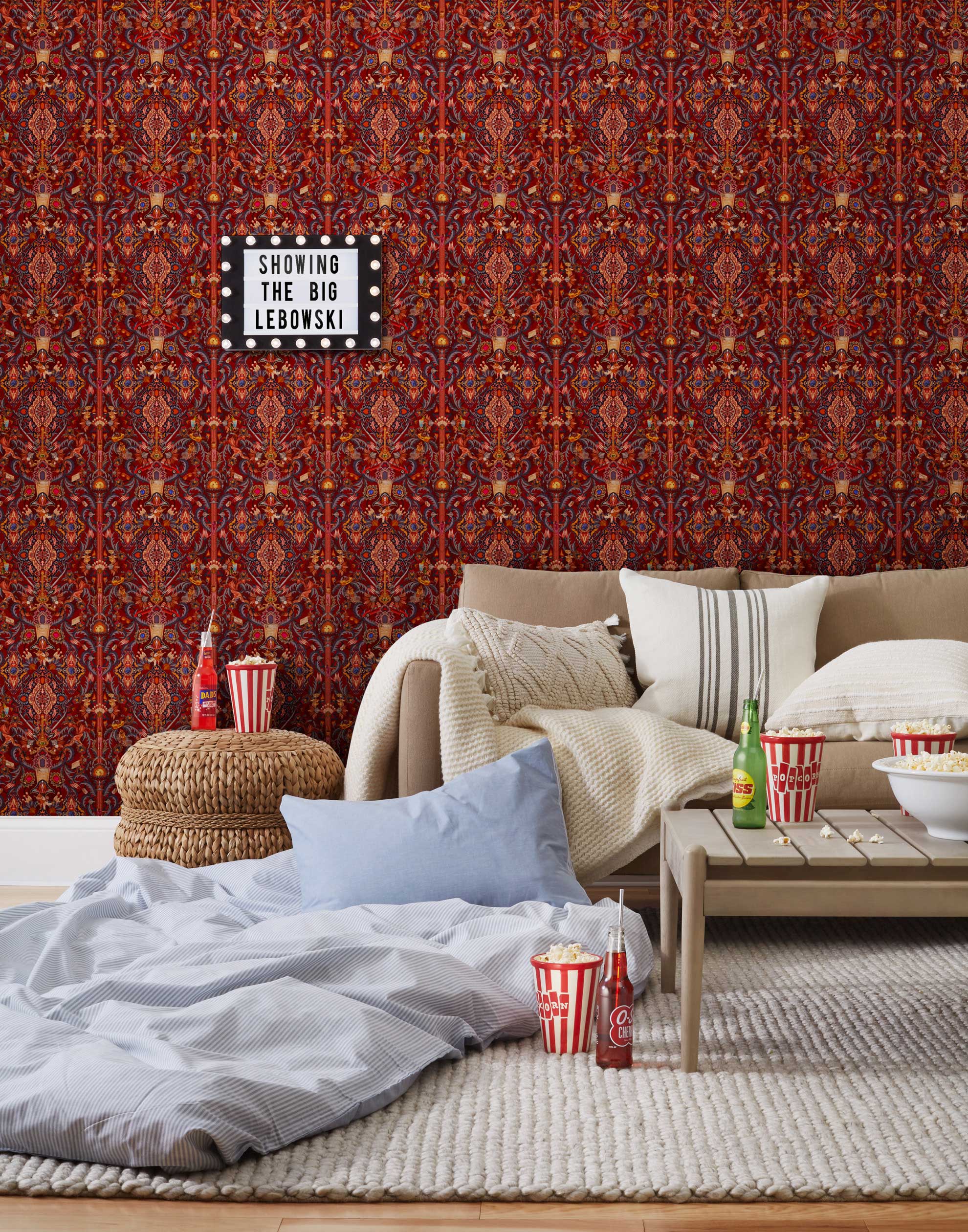 Inspired by The Big Lebowski’s singular characters, "striking" imagery, and oft-quoted dialogue, Abide Wallpaper is a visual feast of iconic movie moments. Red background designed to interpret a rug with hidden characters and scenes form the movie in blue, gray, pink, and orange. Universal + Hygge & West