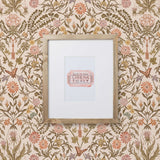 Inspired by the painted ceiling of Glinda and Elphaba's Shiz University dorm room in the movie Wicked, this wallpaper features colorful flowers and a crown on a soft pink background.
