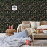 Inspired by the painted ceiling of Glinda and Elphaba's Shiz University dorm room in the movie Wicked, this wallpaper features colorful flowers and a witch's hat and broom on a dark green background.