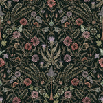 Inspired by the painted ceiling of Glinda and Elphaba's Shiz University dorm room in the movie Wicked, this wallpaper features colorful flowers and a witch's hat and broom on a dark green background.