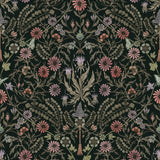 Inspired by the painted ceiling of Glinda and Elphaba's Shiz University dorm room in the movie Wicked, this wallpaper features colorful flowers and a witch's hat and broom on a dark green background.