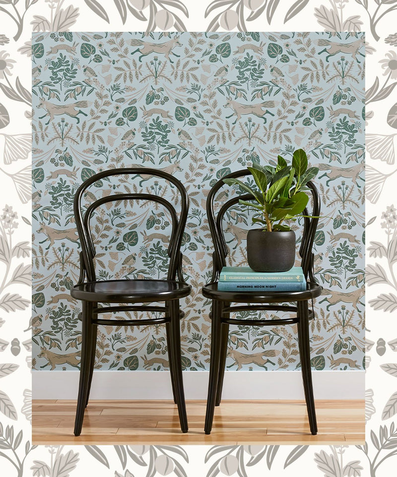 Learn how to apply peel and stick wallpaper using Piedmont wallpaper in colors Mist and Taupe in a room with two chairs