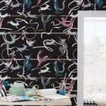 Balancing Act (Ebony) wallpaper features colorful dancing monkeys and rabbits on a black background