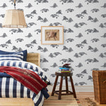 Mighty (Charcoal) wallpaper features gray lions and meerkats on a white background