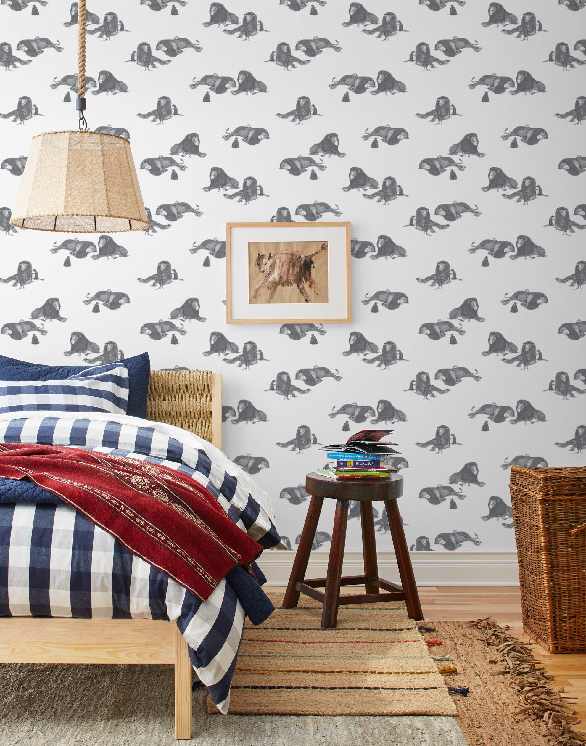 Mighty (Charcoal) wallpaper features gray lions and meerkats on a white background