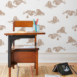 Mighty (Sand) wallpaper features brown lions and meerkats on a white background