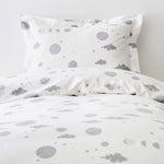 Orbit (Gray) Twin Duvet Set features gray moons, clouds and stars on a soft white background