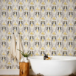 Mermaids (Gold) wallpaper | Mermaids, fish, octopi and ships float in this charming design | Gold and black artwork on an off white ground