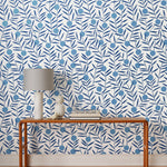 Bloom (Bluebell) Wallpaper featuring dusty blue dots and deep blue stems on a white ground in a modern, graphic floral 