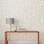Bloom (Taupe) Wallpaper featuring light gray dots and taupe stems on an off white ground in a modern, graphic floral