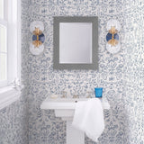 Storyline (Delft Blue) Wallpaper | Folk art inspired pattern featuring flora and fauna in a delft blue on a white ground