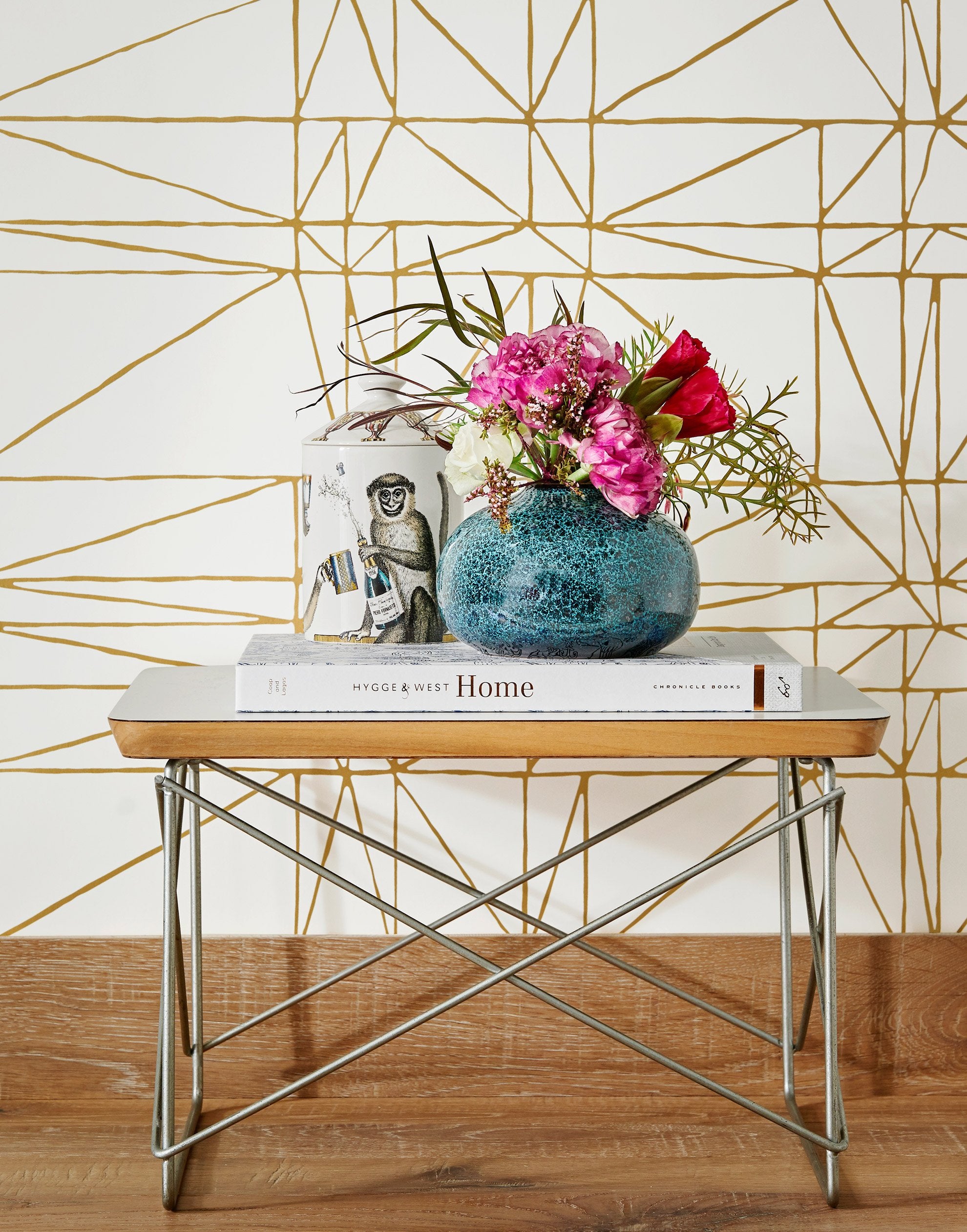 Strike (Gold) features modern, geometric metallic gold lines on white