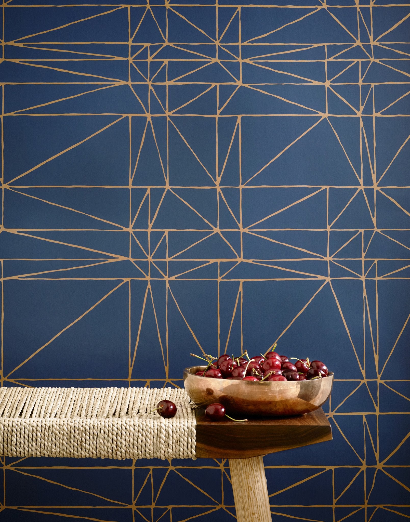 Strike (Navy) features modern, geometric metallic gold lines on navy blue