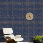 Strike (Navy) features modern, geometric metallic gold lines on navy blue