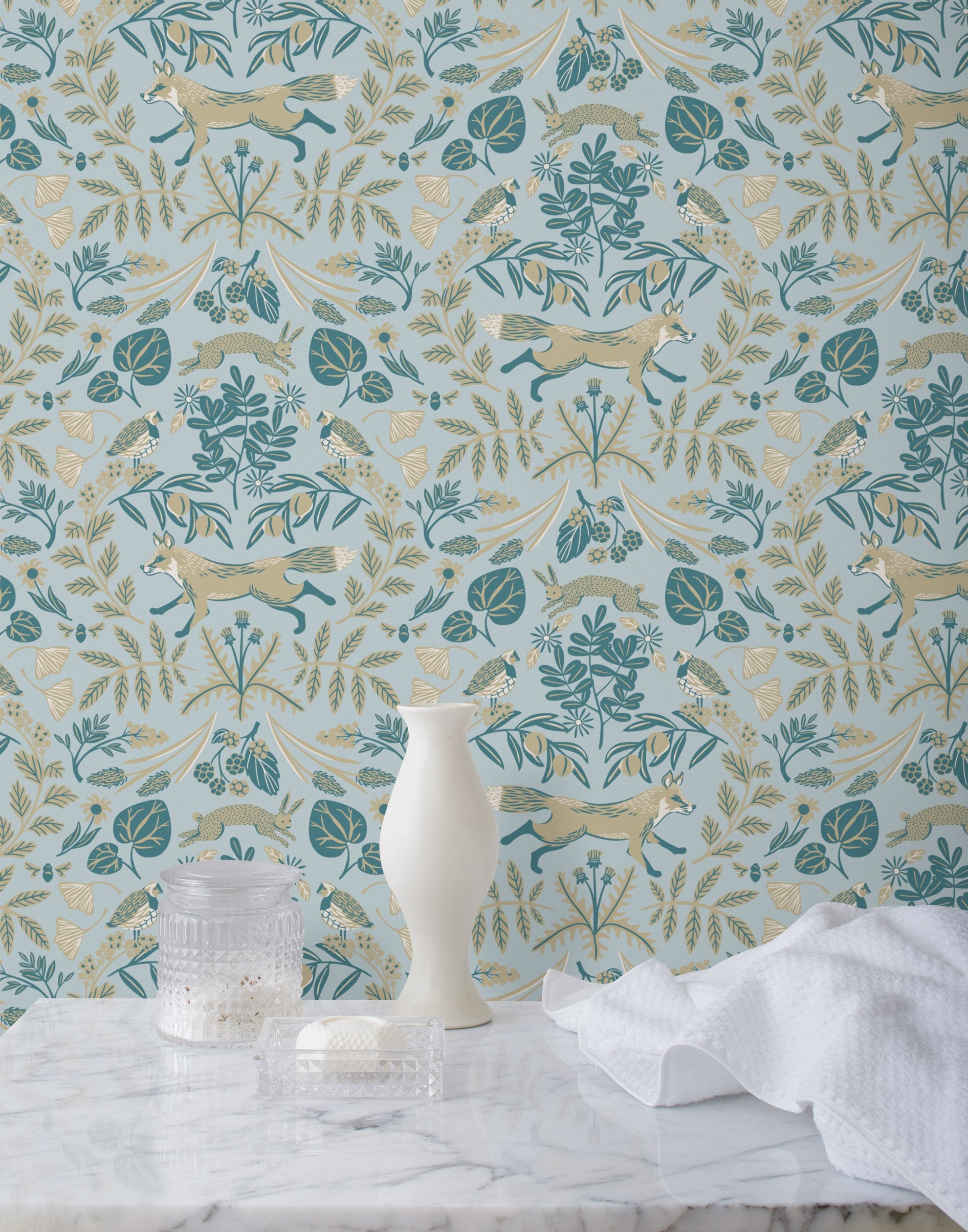 Piedmont (Mist) wallpaper with tan foxes, dusty deep green flora, cream accents on a light gray blue background