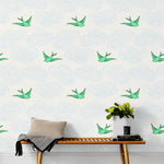Daydream (Green) features a pattern of flying birds and floating clouds in green and blue white