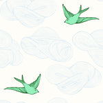 Daydream (Green) features a pattern of flying birds and floating clouds in green and blue white