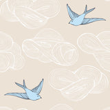 Daydream (Cream) features a pattern of flying birds and floating clouds in blue and white on cream