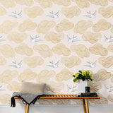 Daydream (Blush) features a pattern of flying birds and floating clouds in metallic gold and white on pink 
