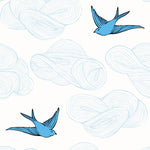 Daydream (French Blue) features a pattern of flying birds and floating clouds in shades of blue on white