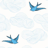 Daydream (French Blue) features a pattern of flying birds and floating clouds in shades of blue on white