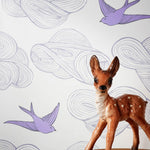 Daydream (Lilac) features a pattern of flying birds and floating clouds in purple and gray on white