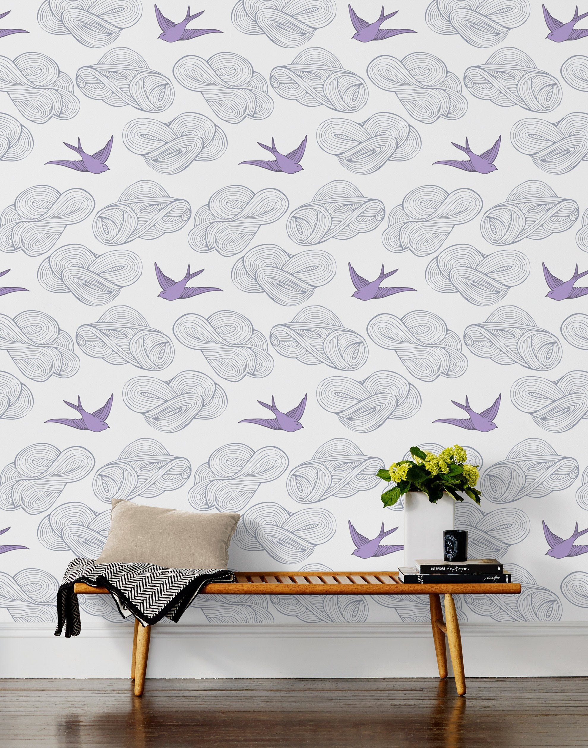 Daydream (Lilac) features a pattern of flying birds and floating clouds in purple and gray on white