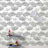 Daydream (Black) features a pattern of flying birds and floating clouds in black on white