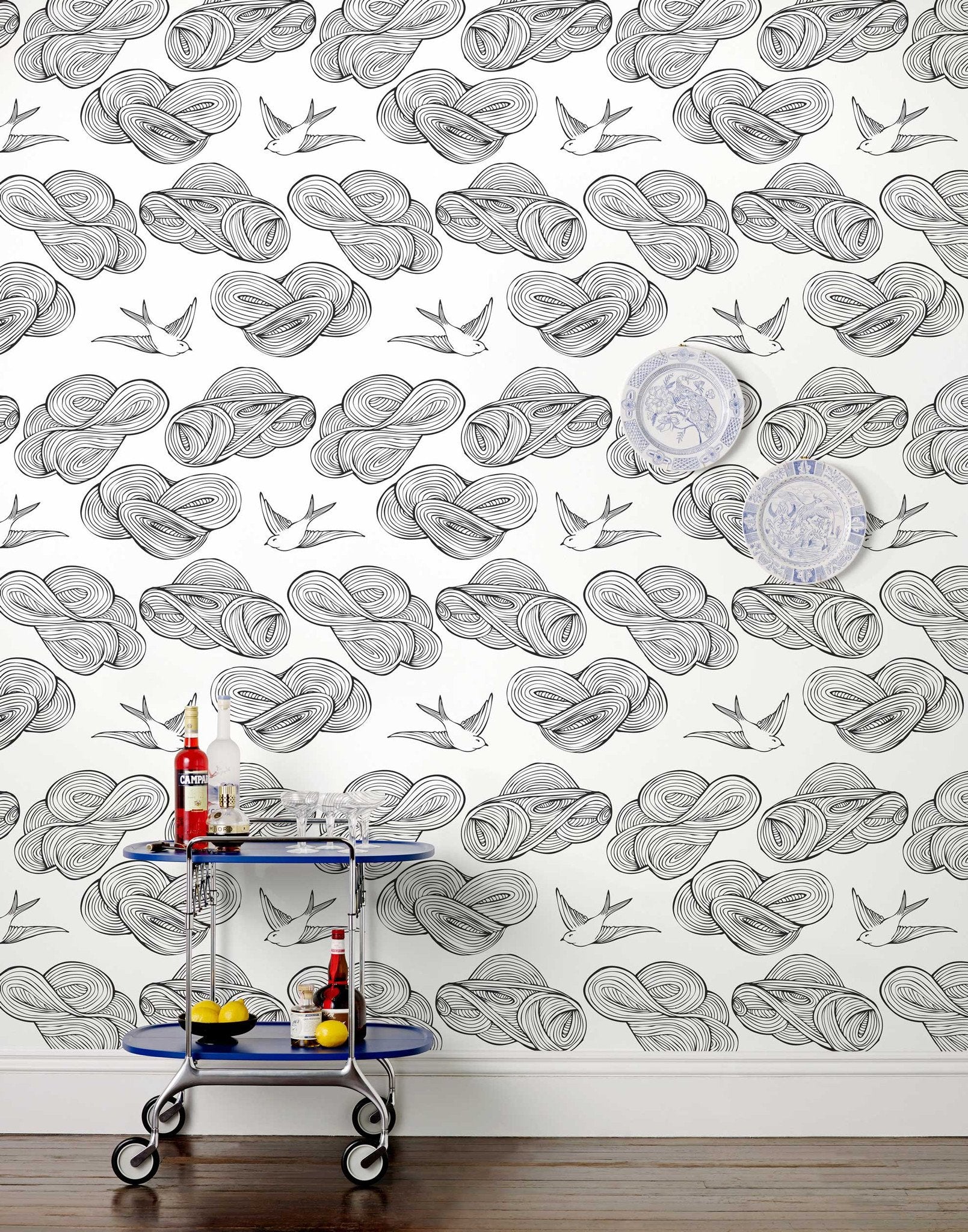 Daydream (Black) features a pattern of flying birds and floating clouds in black on white