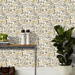 Foret (Gold) features magical animals and flowers in metallic gold, tan and gray on white designed by Julia Rothman