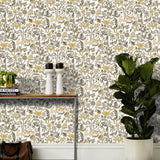 Foret (Gold) features magical animals and flowers in metallic gold, tan and gray on white designed by Julia Rothman