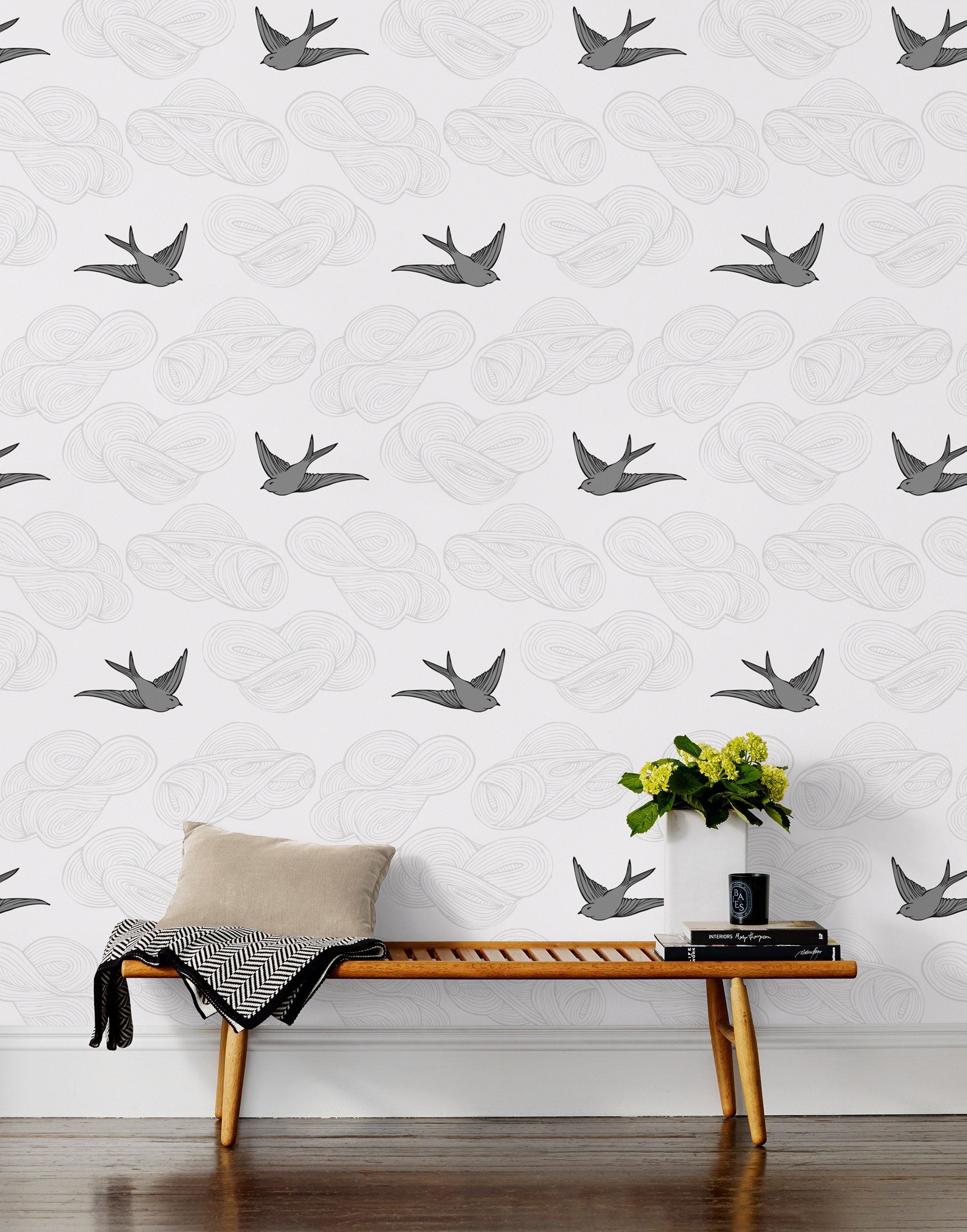 Daydream (Light Gray) features a pattern of flying birds and floating clouds in gray on white