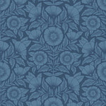 Conservatory wallpaper featuring stylized petals and leaves dervived from a block-print technique was designed by Katharine Watson for Hygge & West. Featuring cornflower blue flowers on a navy blue wallpaper background.