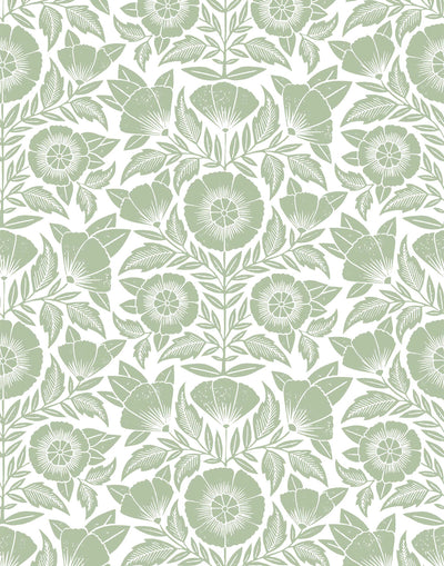 Conservatory wallpaper featuring stylized petals and leaves dervived from a block-print technique was designed by Katharine Watson for Hygge & West. Featuring sage green flowers on a white wallpaper background.