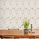 Sonoma (White) wallpaper with rust, green and brown flowers and leaves on a true white background