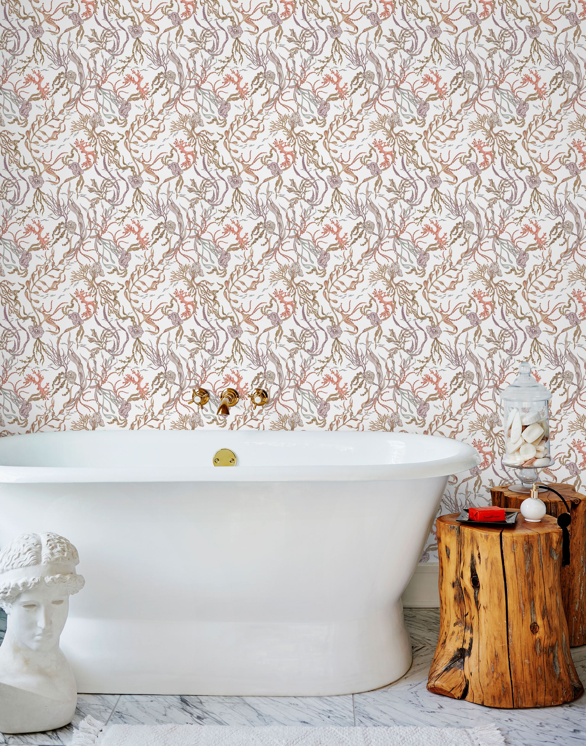 Atoll (White) wallpaper features shades of green, coral and brown seaweed and coral on a true white background