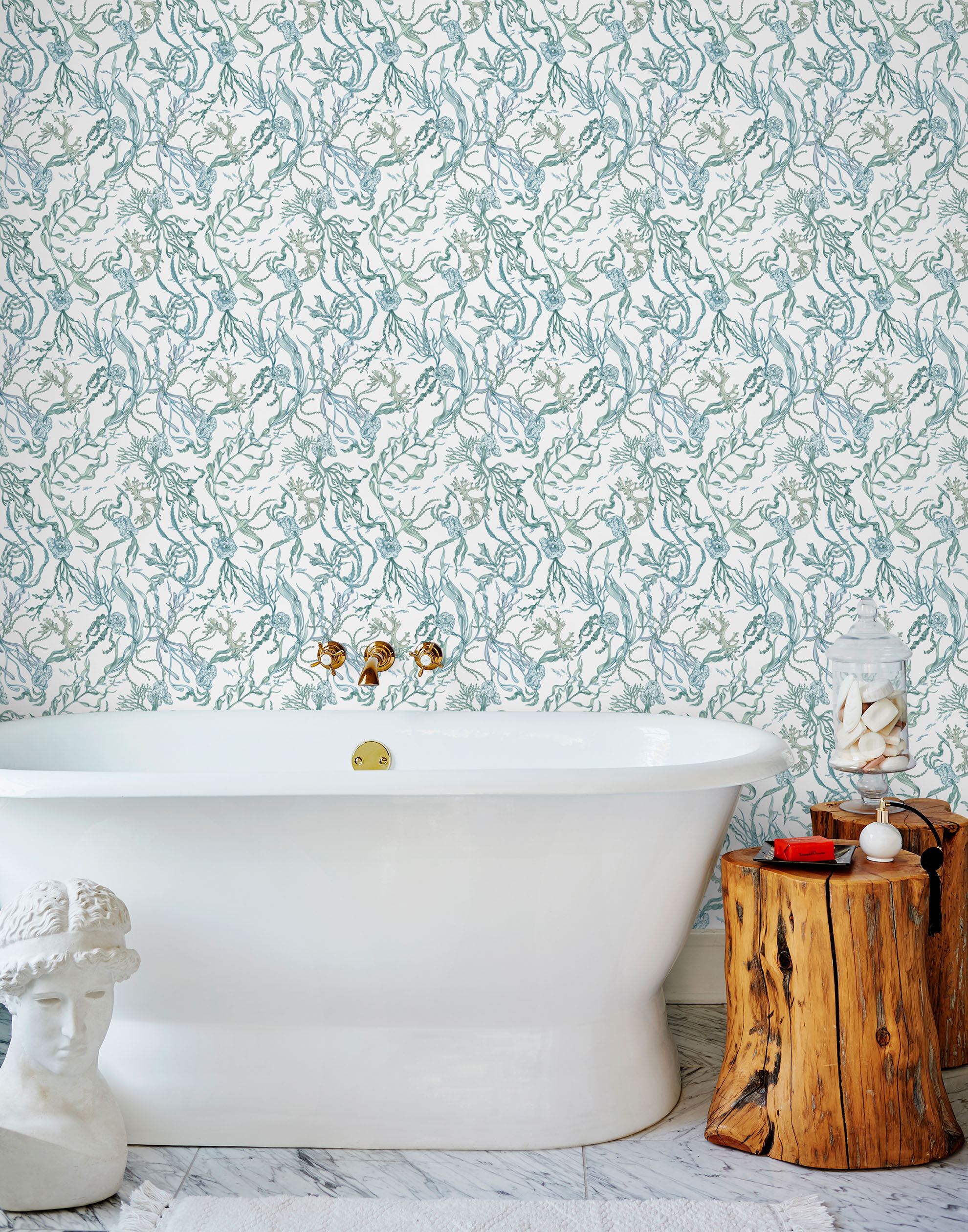 Atoll (Marine) wallpaper features shades of green and blue seaweed and coral on a true white background