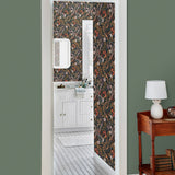 Atoll (Coral) wallpaper features shades of orange, purple, brown and green seaweed and coral on a soft black background