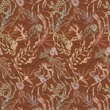 Atoll (Sienna) wallpaper features shades of green, pink, peach, taupe and black seaweed and coral on a brown background