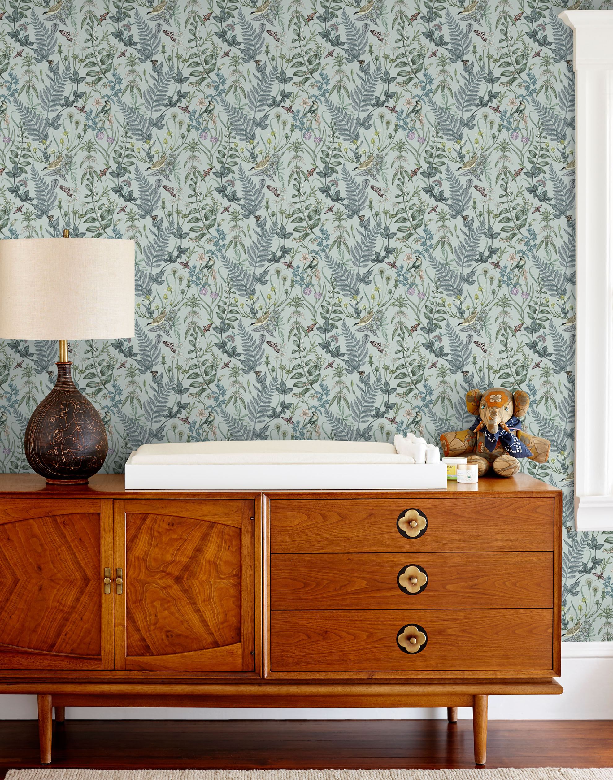 Secret Garden (Robin Egg) wallpaper features shades of green, blue and brown plants, birds and butterflies on a robin egg blue background