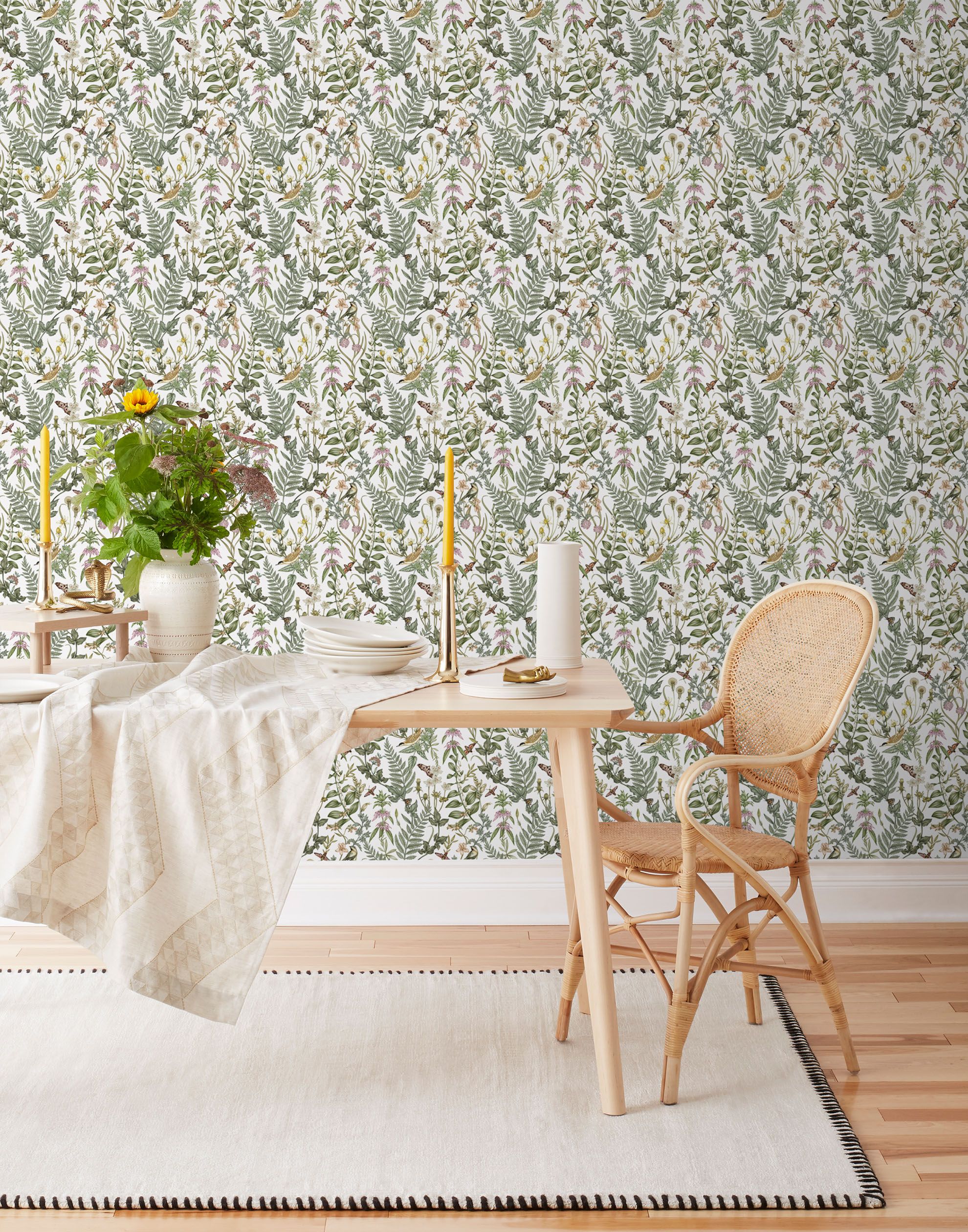 Secret Garden (White) wallpaper features shades of green, brown and pink plants, birds and butterflies on a true white background