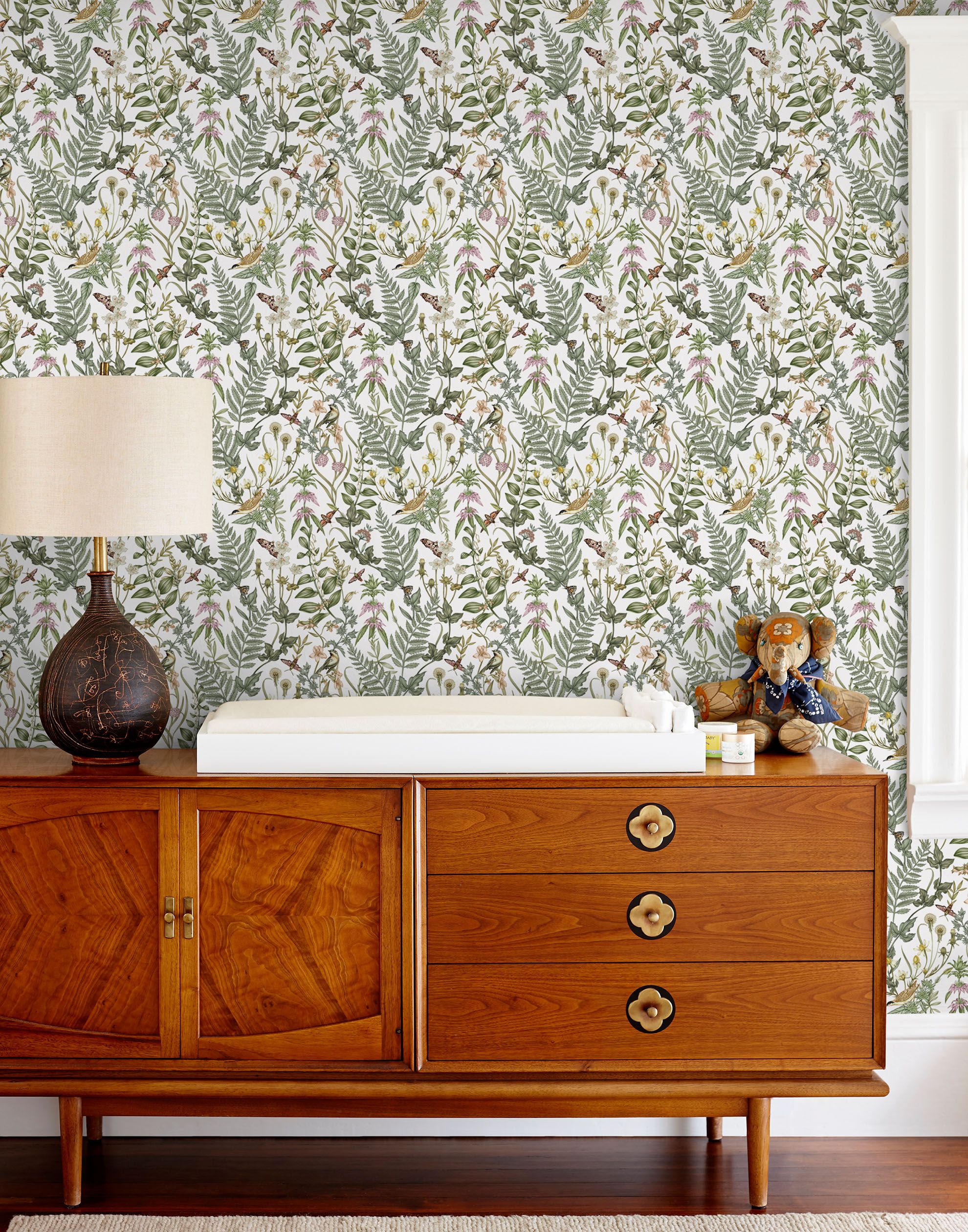 Secret Garden (White) wallpaper features shades of green, brown and pink plants, birds and butterflies on a true white background